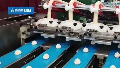 Machine de production de petits pains fourrés