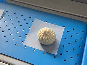 Machine automatique de pose de papier sulfurisé